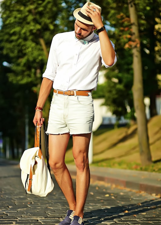Distressed Denim Shorts with Rolled-Sleeve Shirt for Casual Adventures Distressed Denim Shorts with Rolled-Sleeve Shirt for Casual Adventures — Mens Vacation Outfits