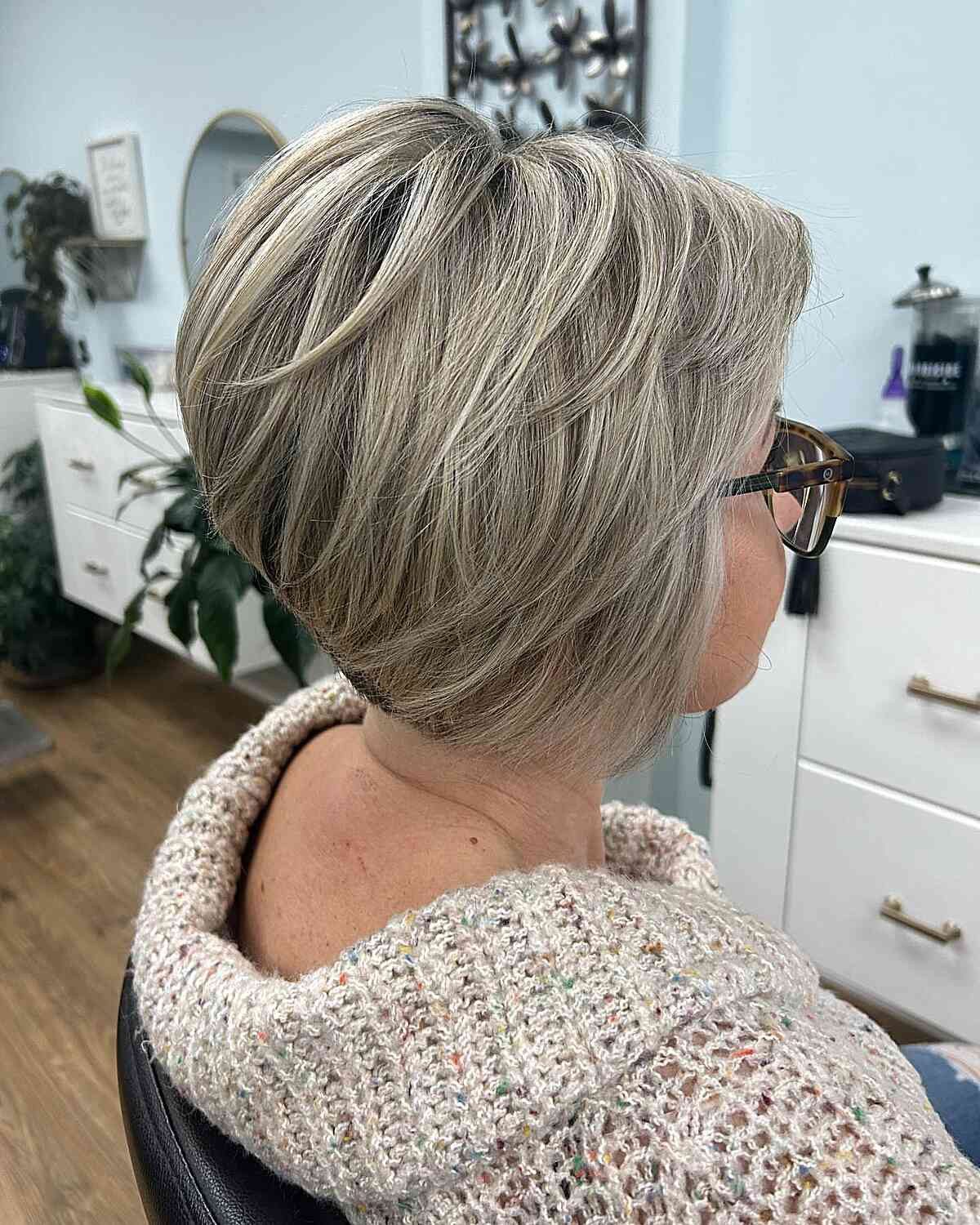 Stacked Bob With Smooth Blowout — Haircuts for Women Over 50 with Glasses