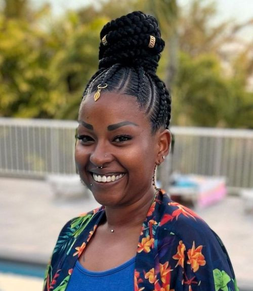 Cornrow Bun Adorned with Gold Accessories Cornrow Bun Adorned with Gold Accessories