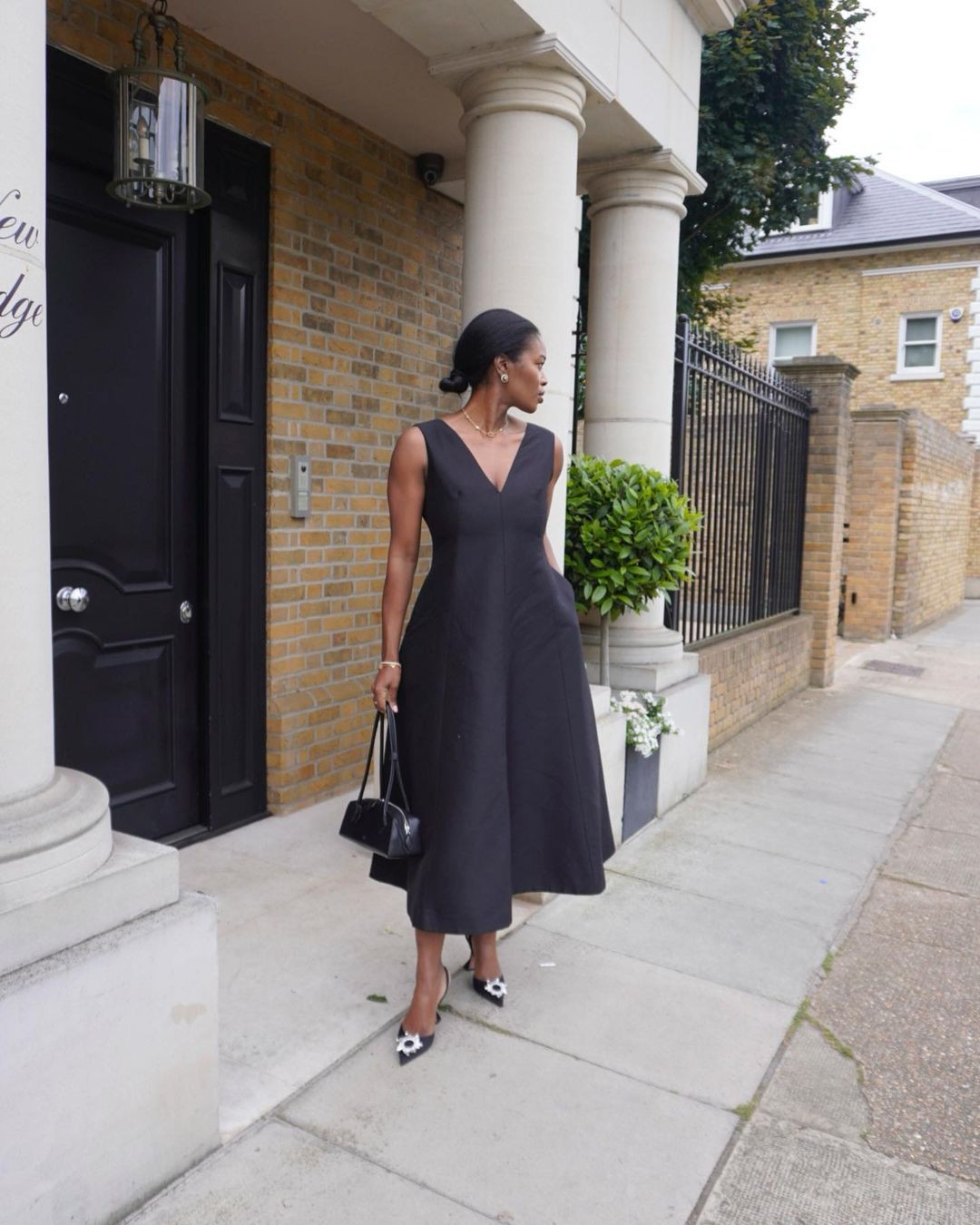 Black A-Line Midi Dress with Statement Floral Heels Black A-Line Midi Dress with Statement Floral Heels — Cocktail Attire Outfits