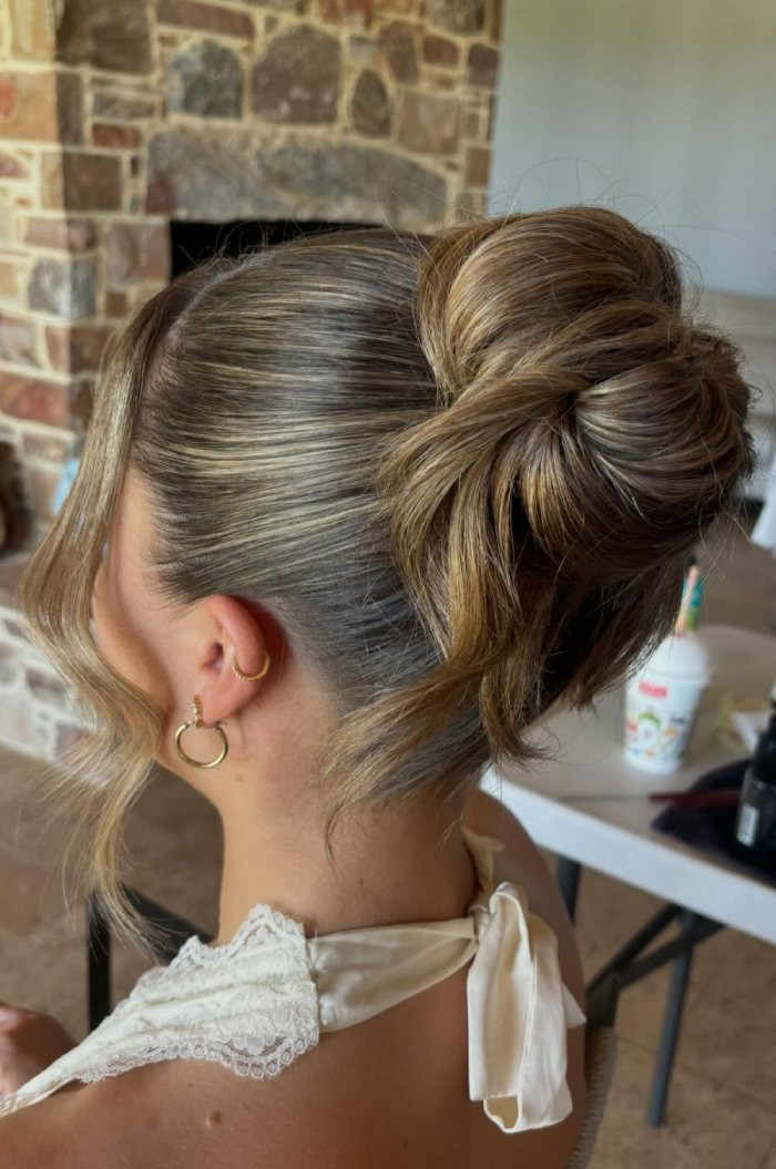 Dark Blonde Balayage Twisted Bun — Low Bun with Bangs