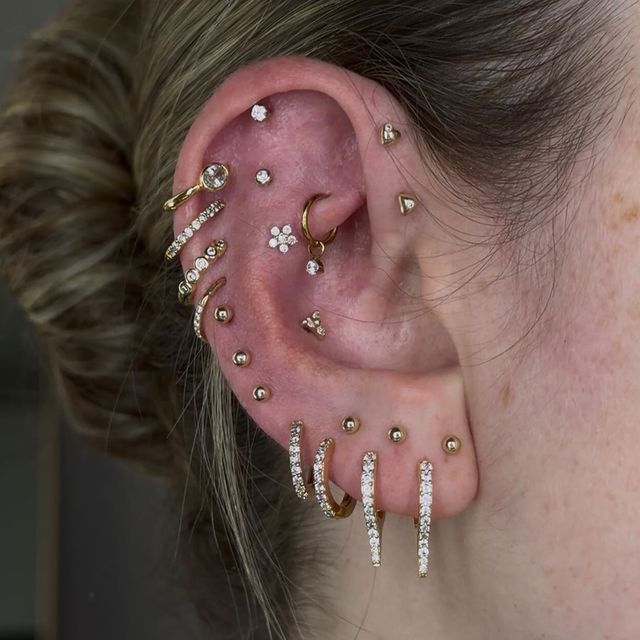 Intricate Gold Earring Arrangement for Varied Occasions Intricate Gold Earring Arrangement for Varied Occasions — Ear Piercing Ideas