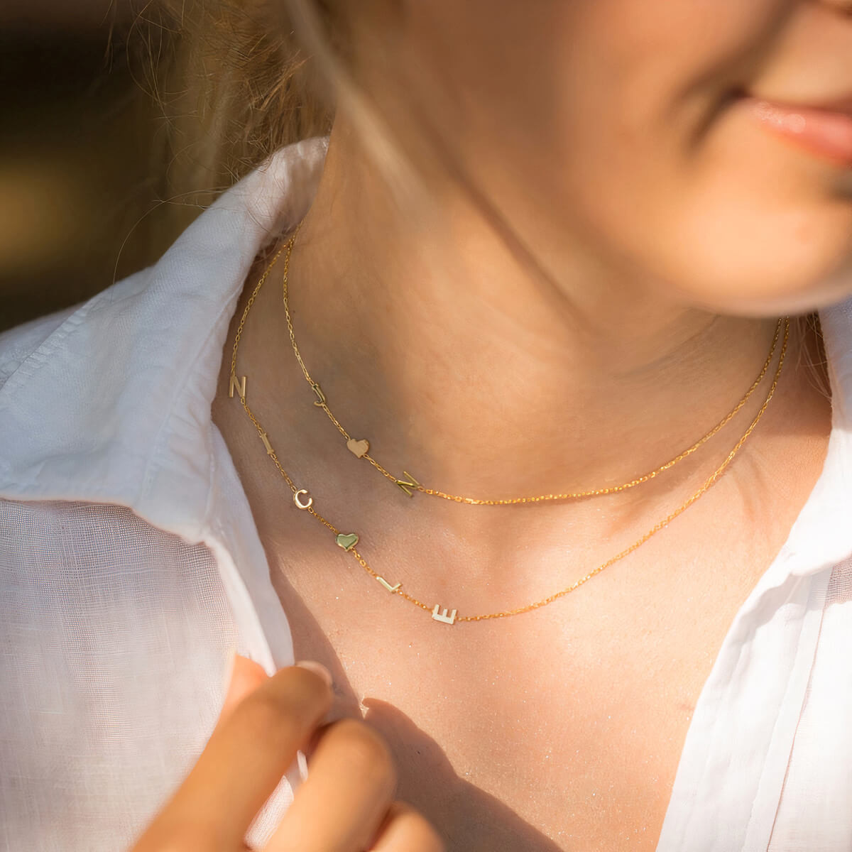 Layered Gold Initials and Hearts on White Shirt Layered Gold Initials and Hearts on White Shirt — Initial Necklaces