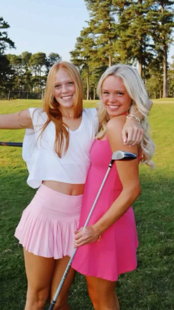 Chic All-Black Ensemble with Flared Pleated Skirt — Golf Tournament Outfits