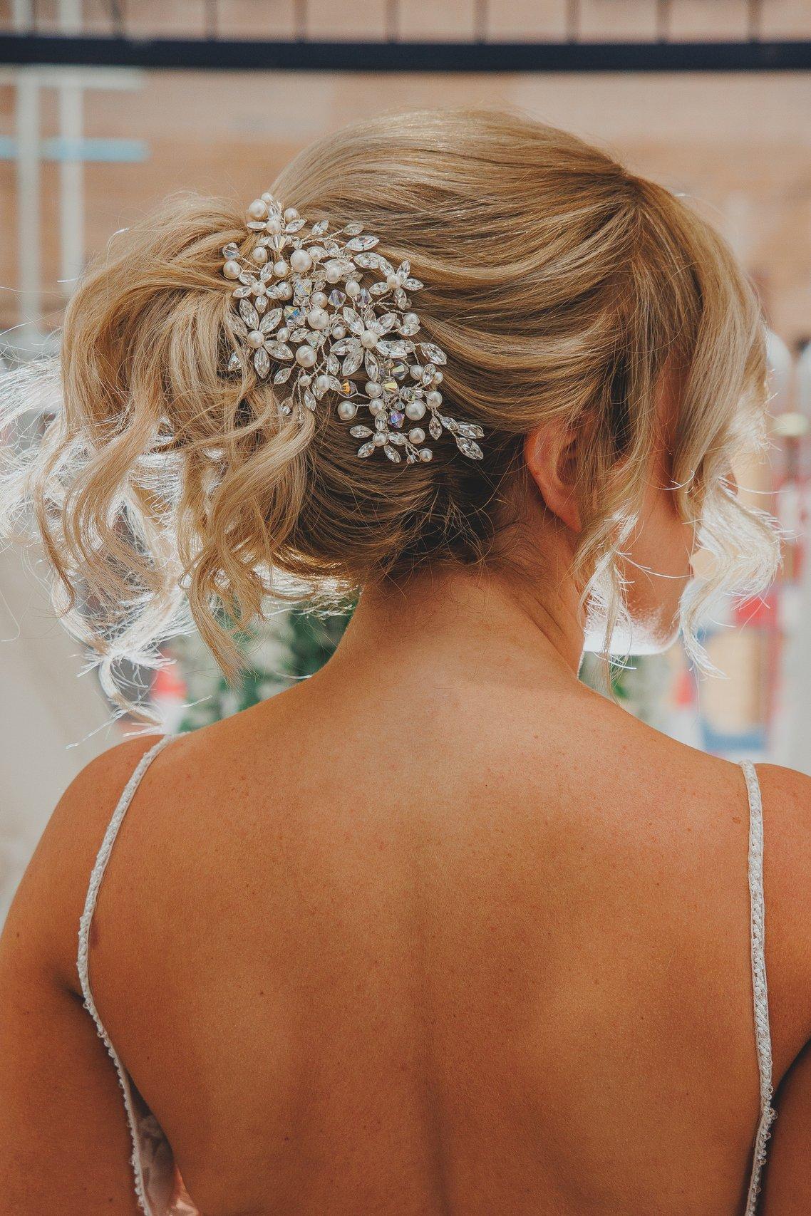 Loose Low Updo with Floral Accessory Loose Low Updo with Floral Accessory — Updos