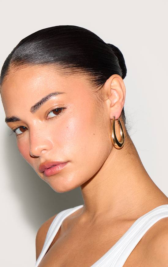 Gold Oval Hoops with a White Tank Top — Hoop Earrings