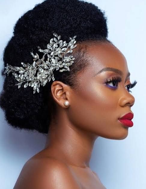 Voluminous Afro Updo With Leaf Accessory Voluminous Afro Updo With Leaf Accessory — Wedding Hairstyles for Black Women