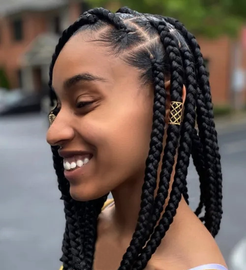 Shoulder-Length Box Braids With Gold Cuffs