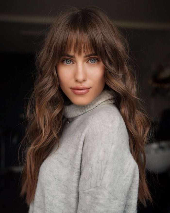 Medium Brown Waves with Blunt Bangs — Hairstyles for Long Faces