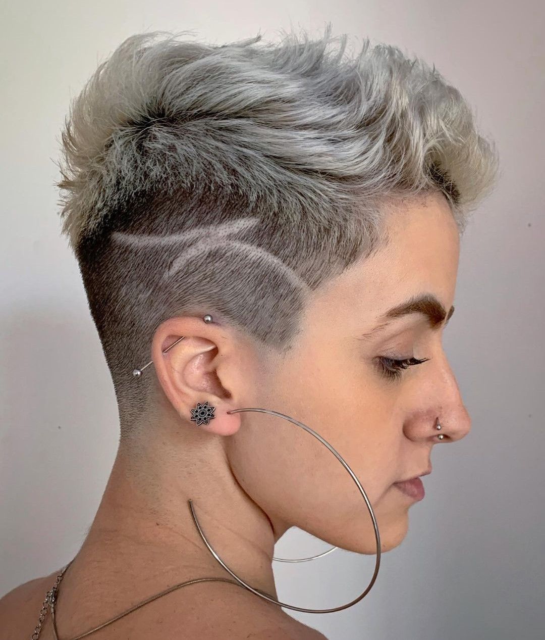 Grey-Blonde Wavy Pixie with Shaved Design — Undercut Hairstyles for Women