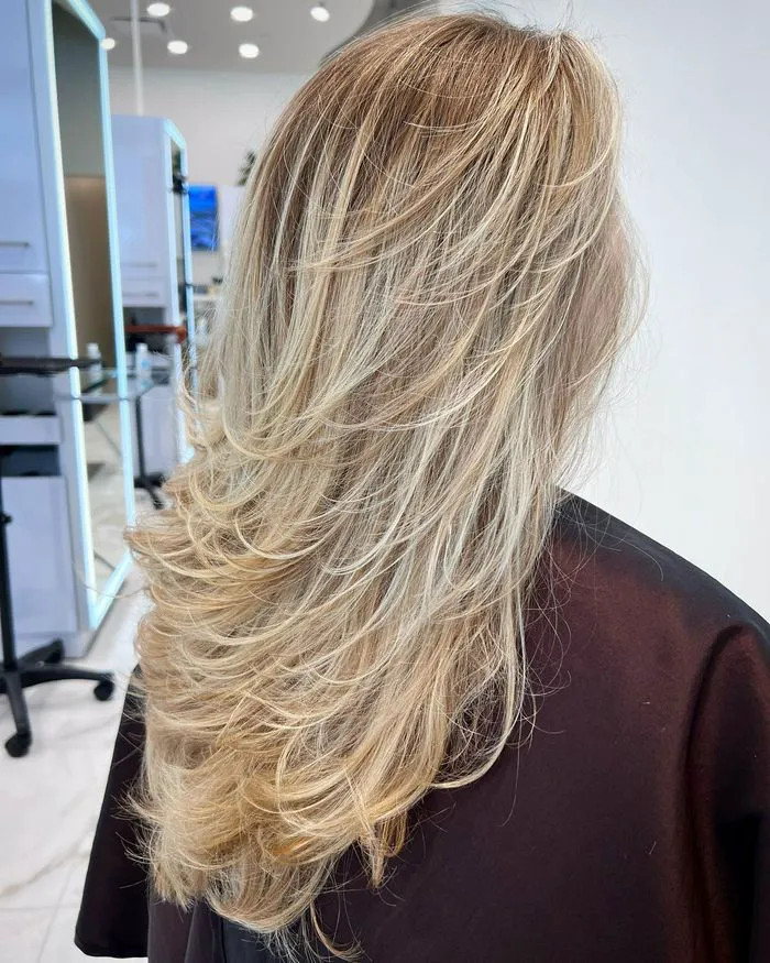 Voluminous Platinum Blonde With Layers — Highlights Over 50