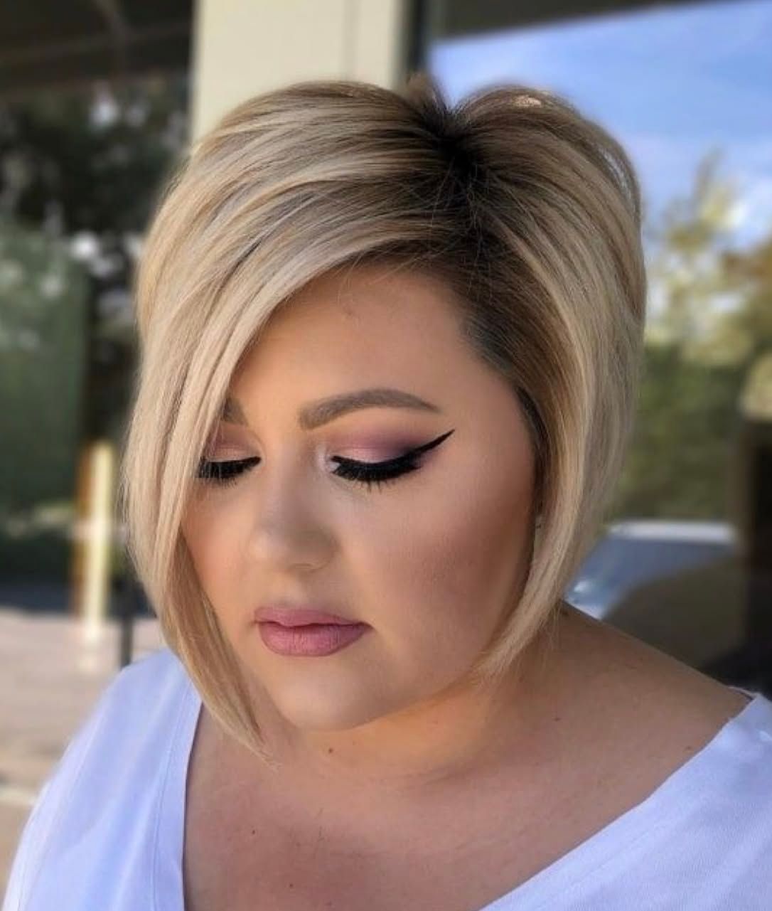 Sleek Angled Bob With Side-Swept Bangs — Hairstyles for Double Chin