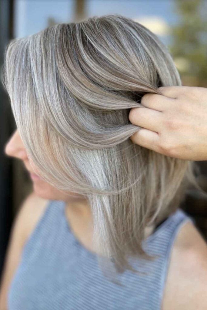 Angled Silver Bob With Side Bangs Angled Silver Bob With Side Bangs — Gray Blending
