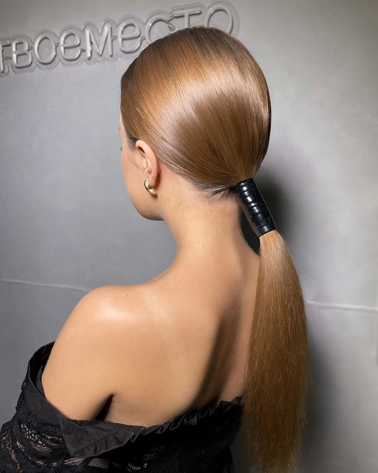 Golden Blonde Ponytail With Black Wrap Detail — Sleek Low Ponytail