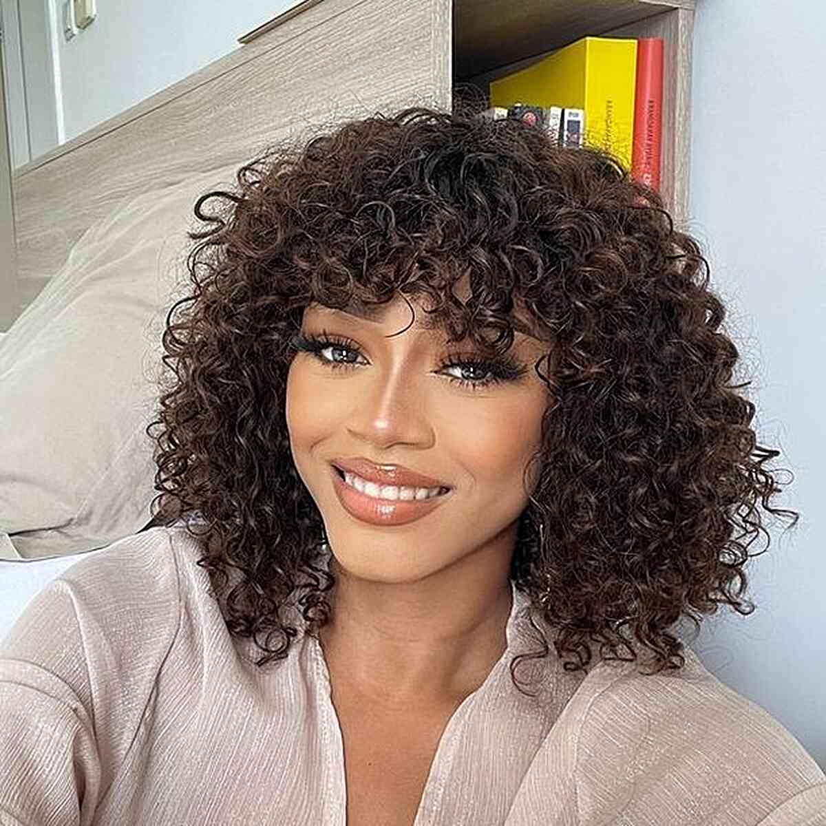 Voluminous Curly Bob With Full Fringe — Weave Hairstyles