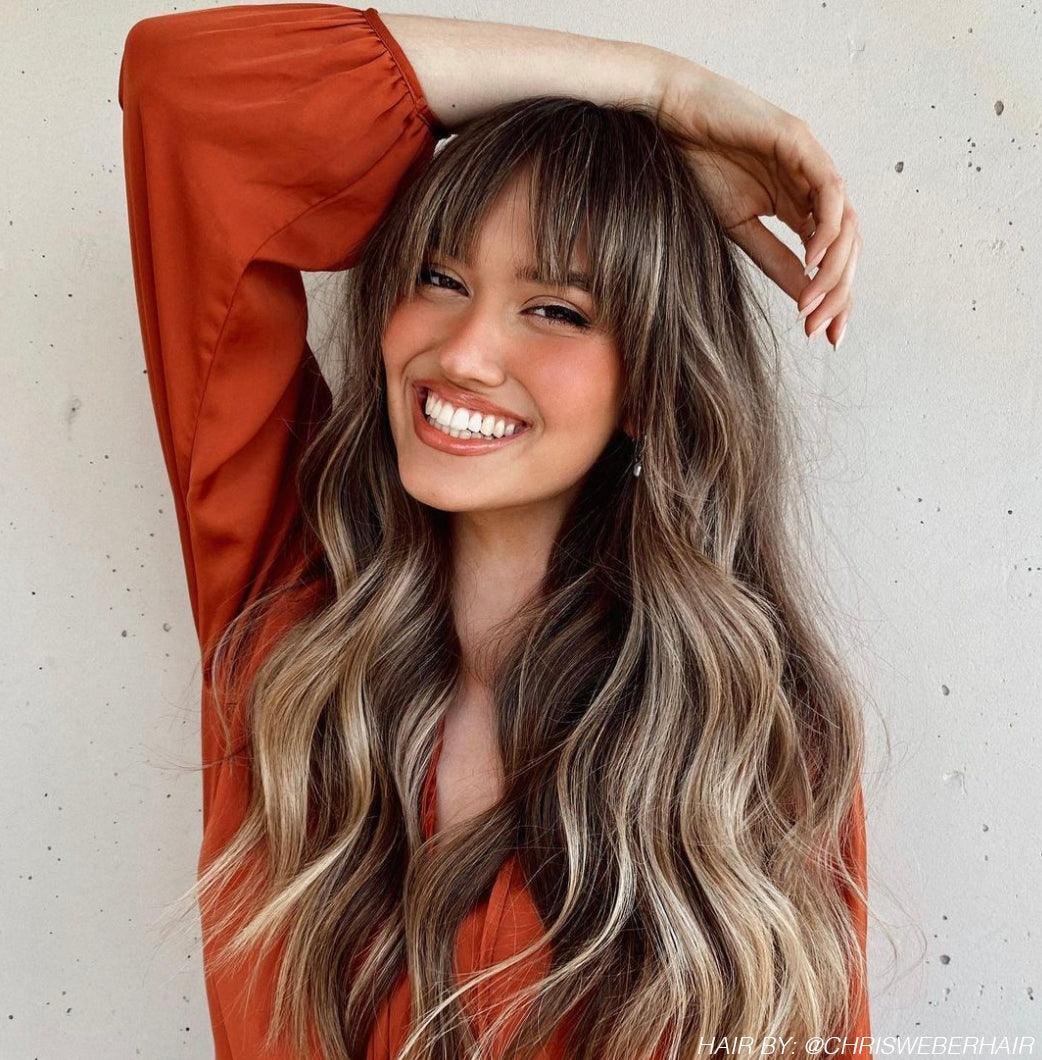 Vibrant Orange Top and Wavy Hair Vibrant Orange Top and Wavy Hair — Long Curtain Bangs