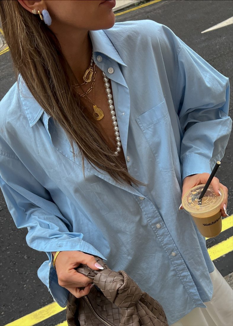 Layered Pearl Necklace with a Light Blue Oversized Shirt Layered Pearl Necklace with a Light Blue Oversized Shirt — Pearl Necklace Outfits