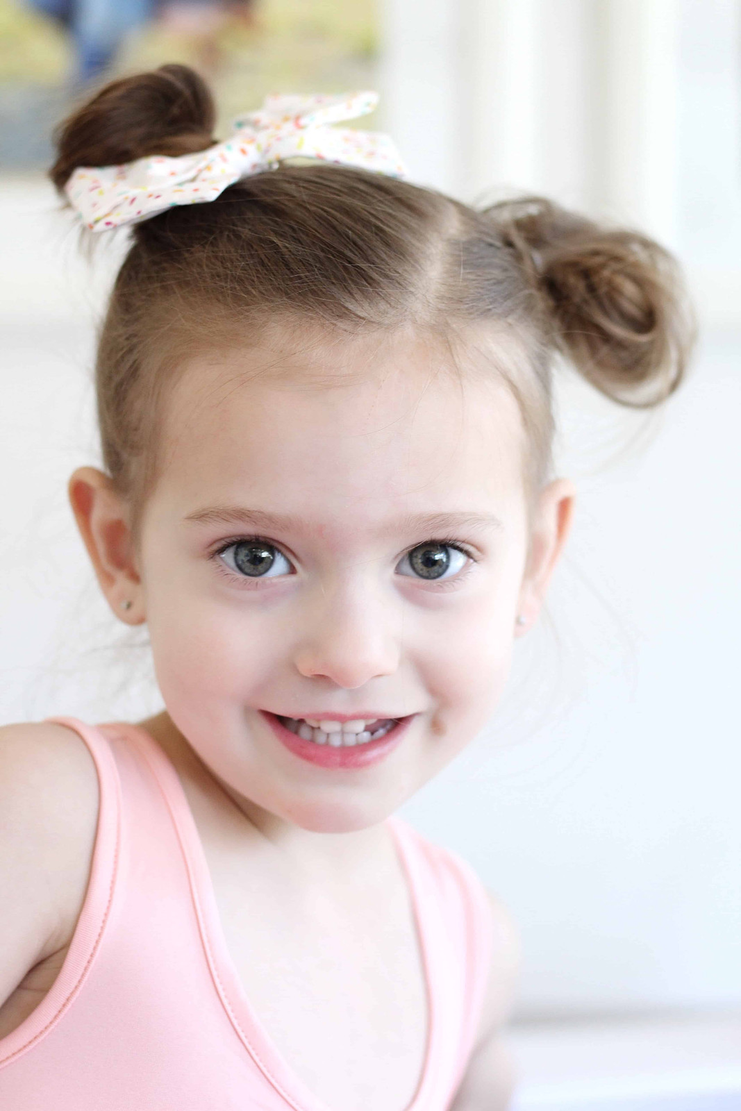 Side Pigtails With Floral Bow Side Pigtails With Floral Bow — Baby Girl Hairstyles