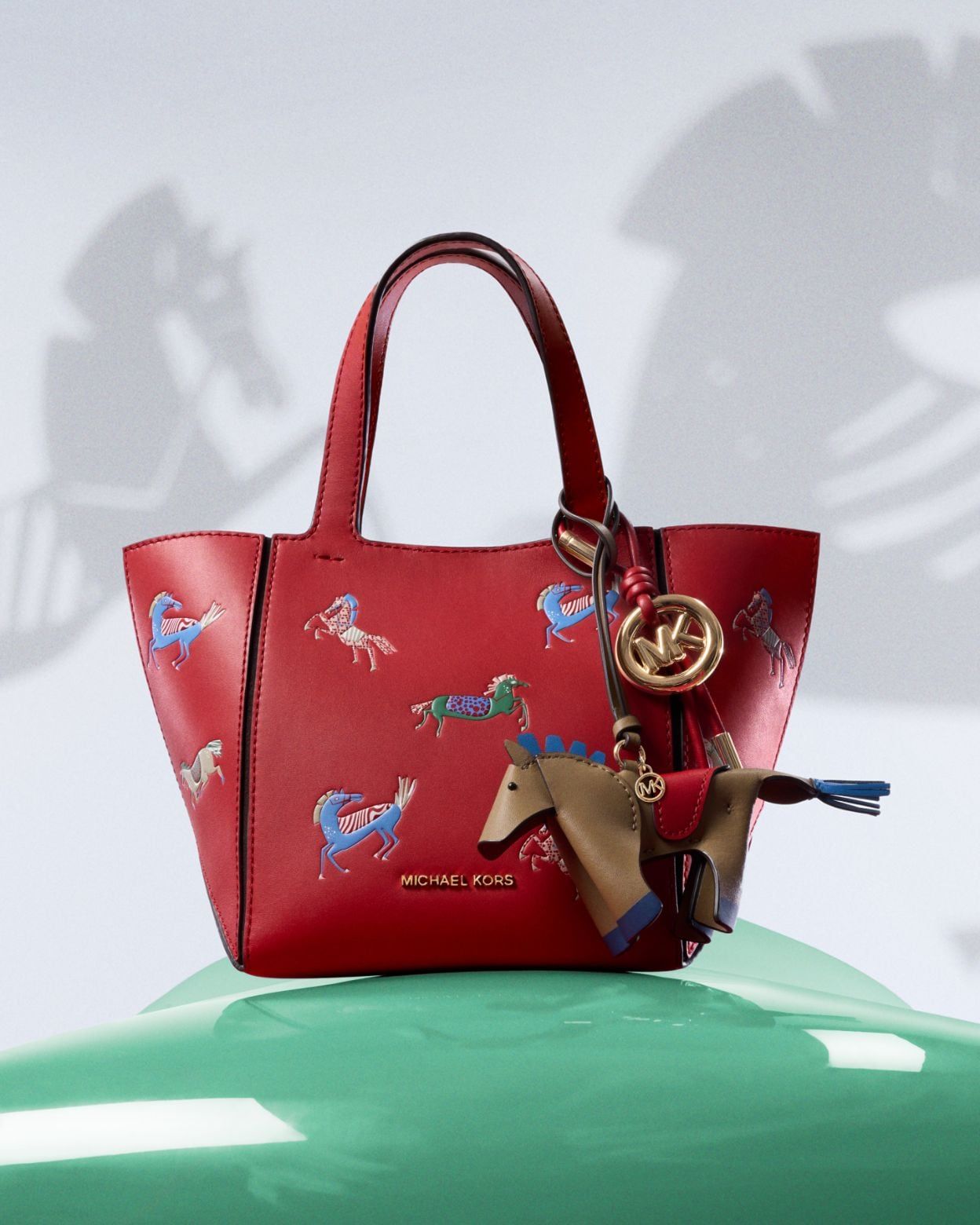 Playful Red Tote Bag with Horse Embellishments — Michael Kors Bag Outfits
