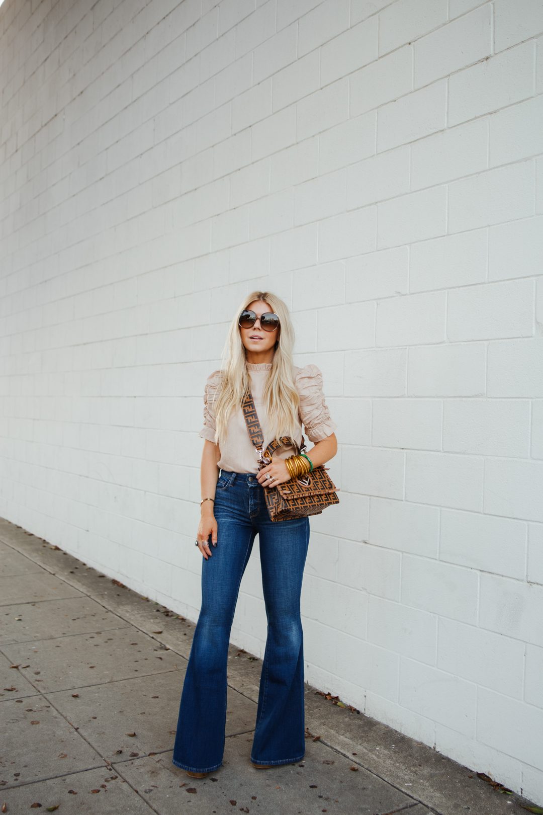 Chic Ruffled Blouse Paired with Dark Flares — Flare Jeans