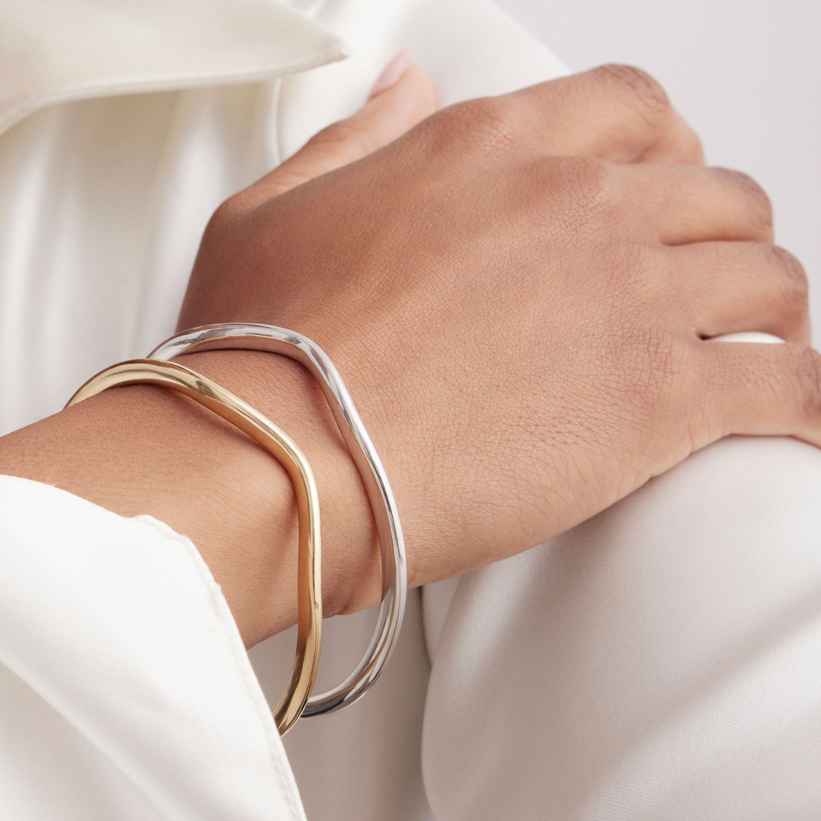 Intertwined Mixed Metal Bangles on Silk Blouse Intertwined Mixed Metal Bangles on Silk Blouse — Mixed Metal Jewelry