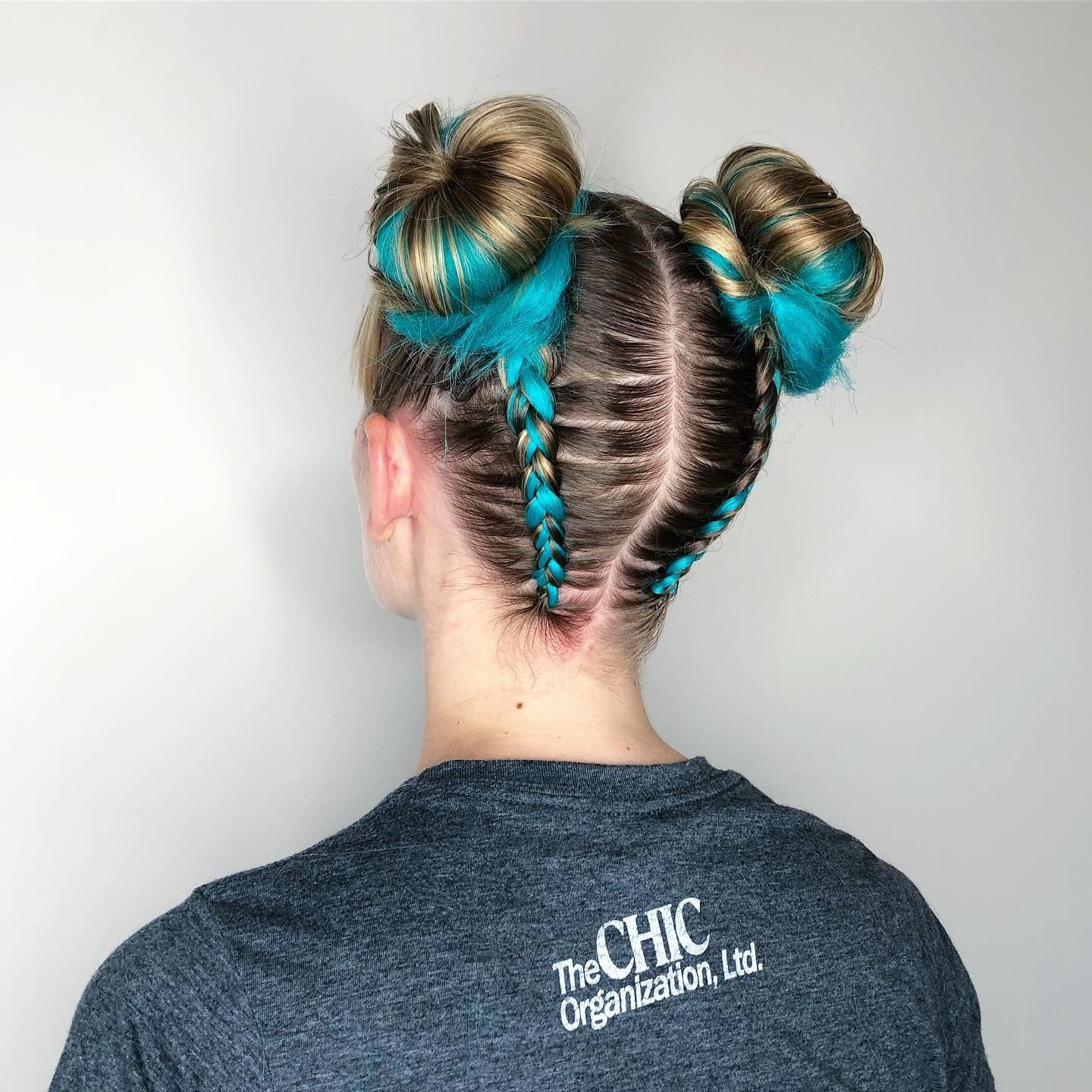 Blonde Space Buns With Vibrant Blue Streaks Blonde Space Buns With Vibrant Blue Streaks