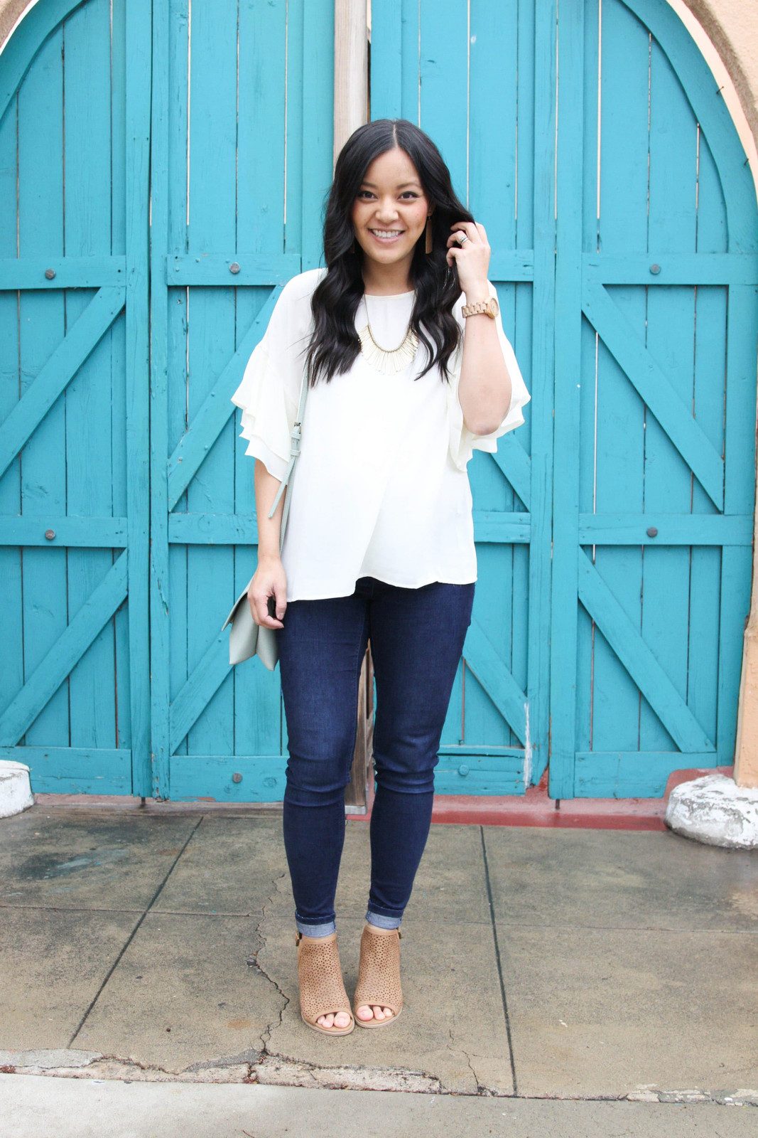 Ruffled Blouse and Skinny Jeans with Perforated Boots — Dressy Casual Outfits