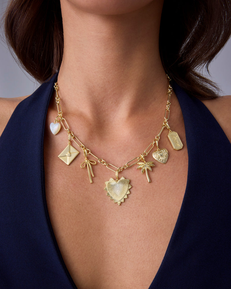 Gold Charm Necklace with Varied Pendants and Hoop Earrings Gold Charm Necklace with Varied Pendants and Hoop Earrings — Chunky Jewelry
