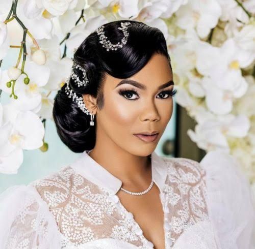 Glossy Updo With Ornate Accessories Glossy Updo With Ornate Accessories — Wedding Hairstyles for Black Women