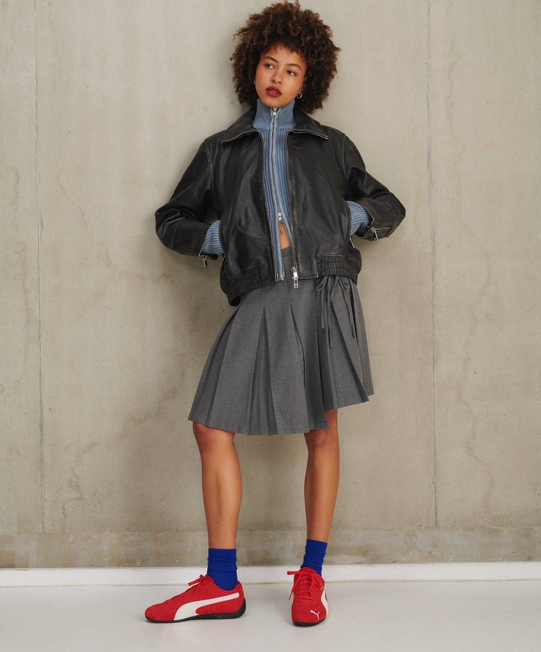 Sporty Chic: Pleated Skirt, Knit Sweater, and Red Speedcats Sporty Chic: Pleated Skirt, Knit Sweater, and Red Speedcats — Puma Speedcat Outfits