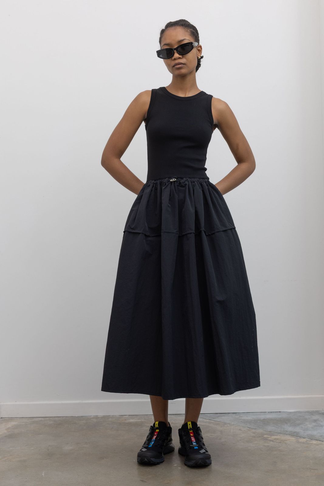 Streetwear Volume: Tiered Skirt and Colorful Accents on Black Salomon Sneakers Streetwear Volume: Tiered Skirt and Colorful Accents on Black Salomon Sneakers — Salomon Outfits