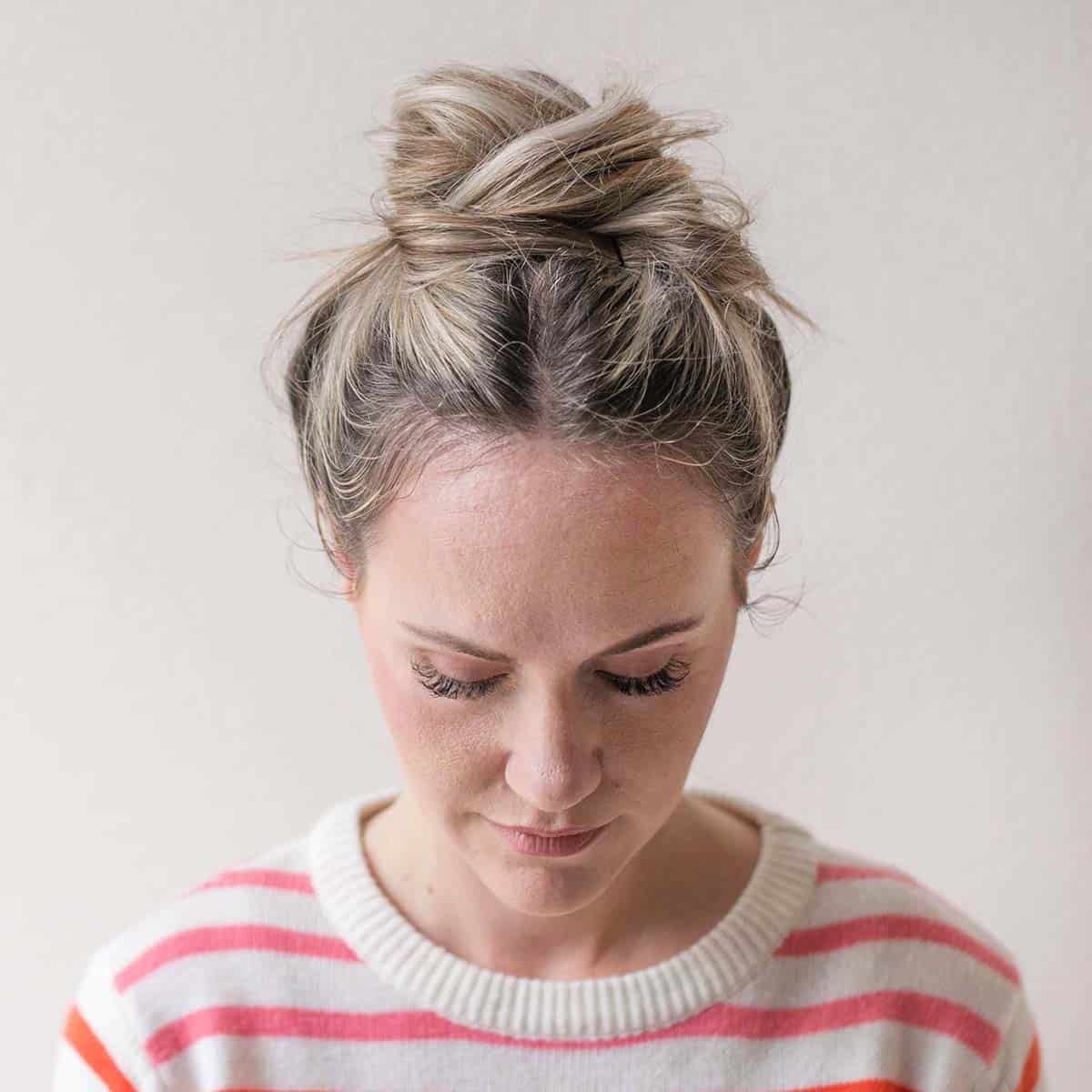 High Messy Bun with Wispy Strands