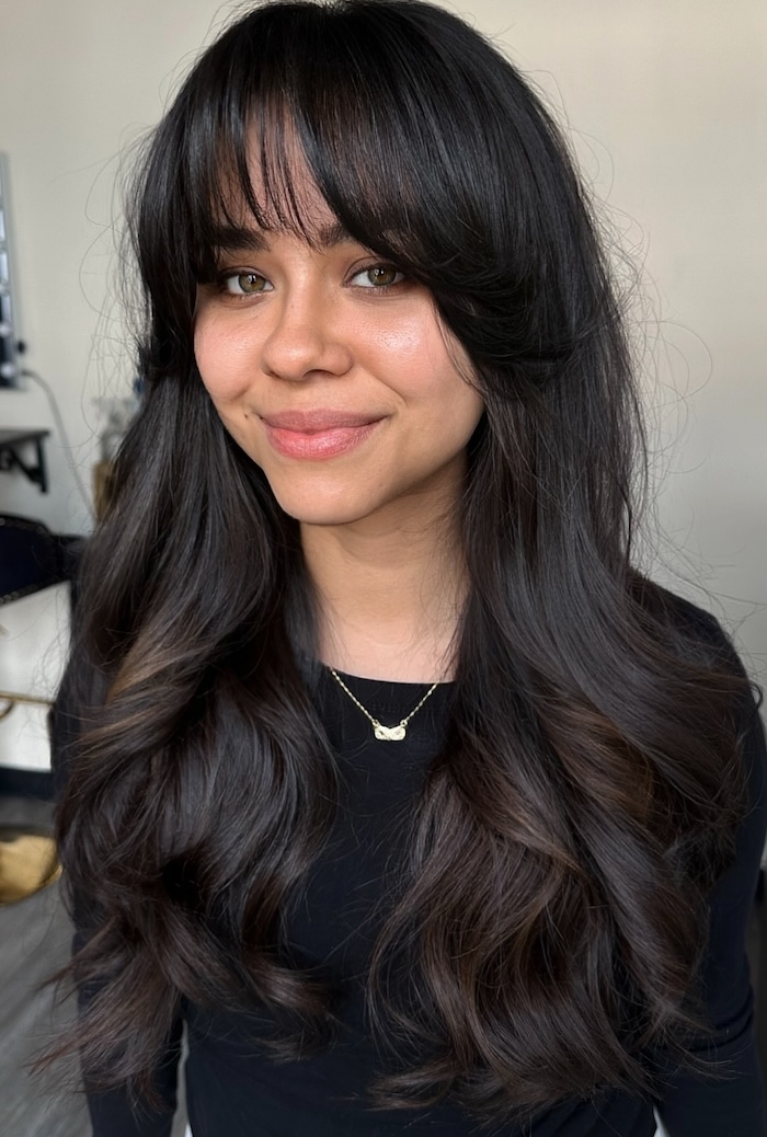 Black Knit Top and Wavy Dark Hair Black Knit Top and Wavy Dark Hair — Long Curtain Bangs