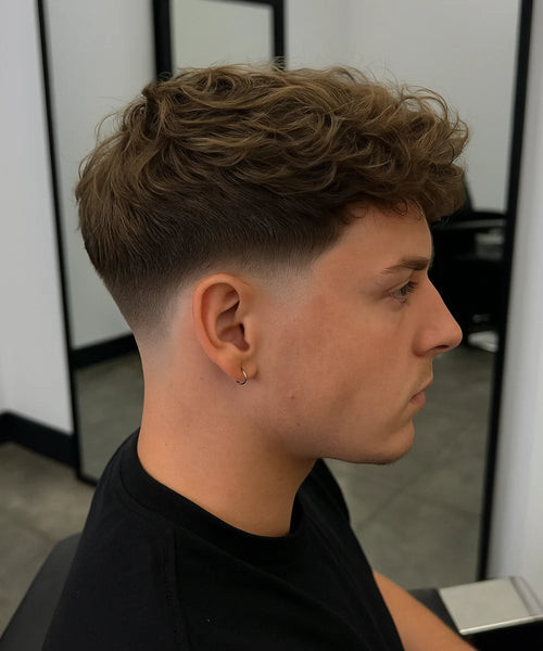 Textured Wavy Top Light Brown Highlights Textured Wavy Top Light Brown Highlights — Low Taper Fade