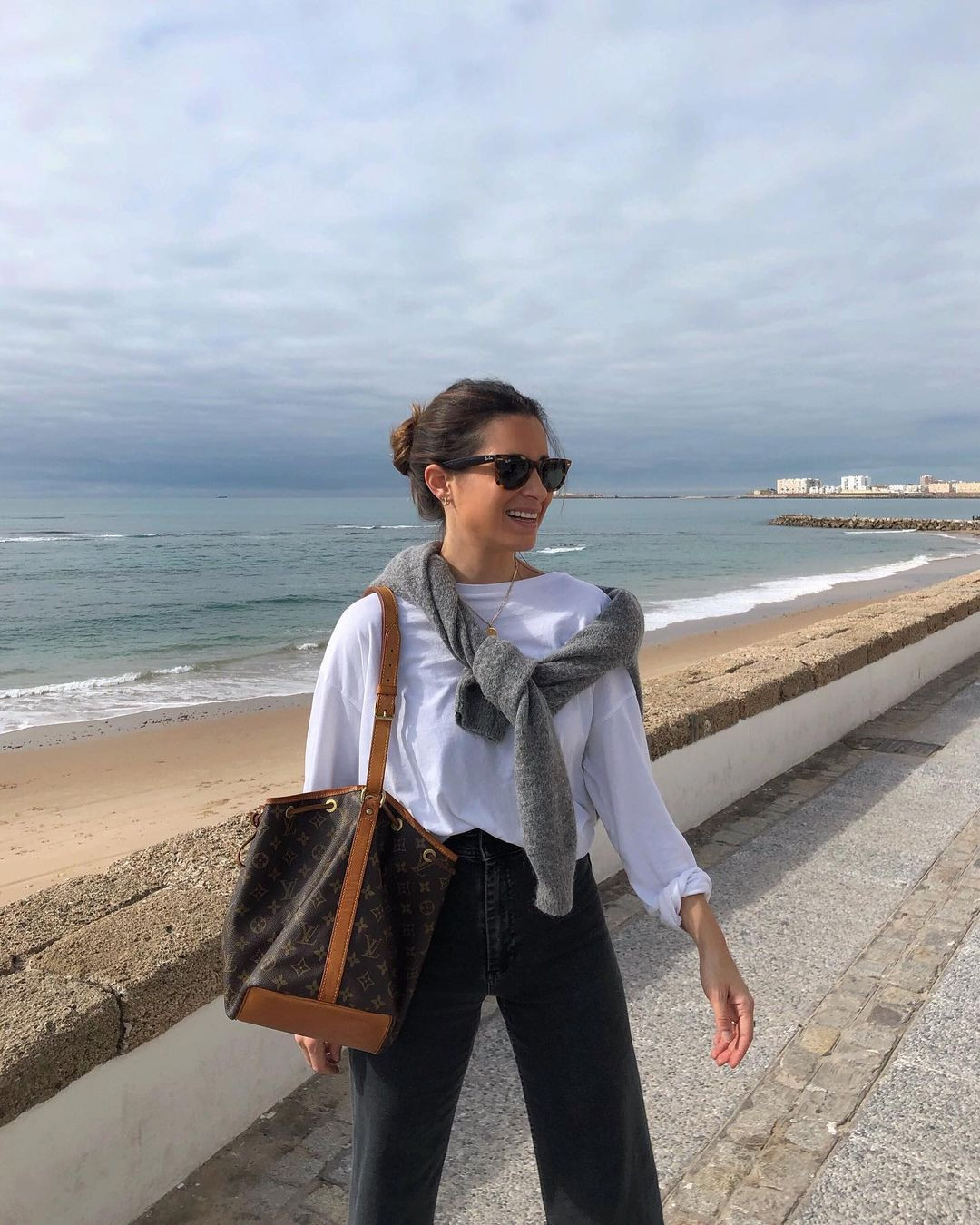 Coastal Casual: Monogram Canvas Bucket Bag with Wide-Leg Jeans — Bucket Bag Outfits