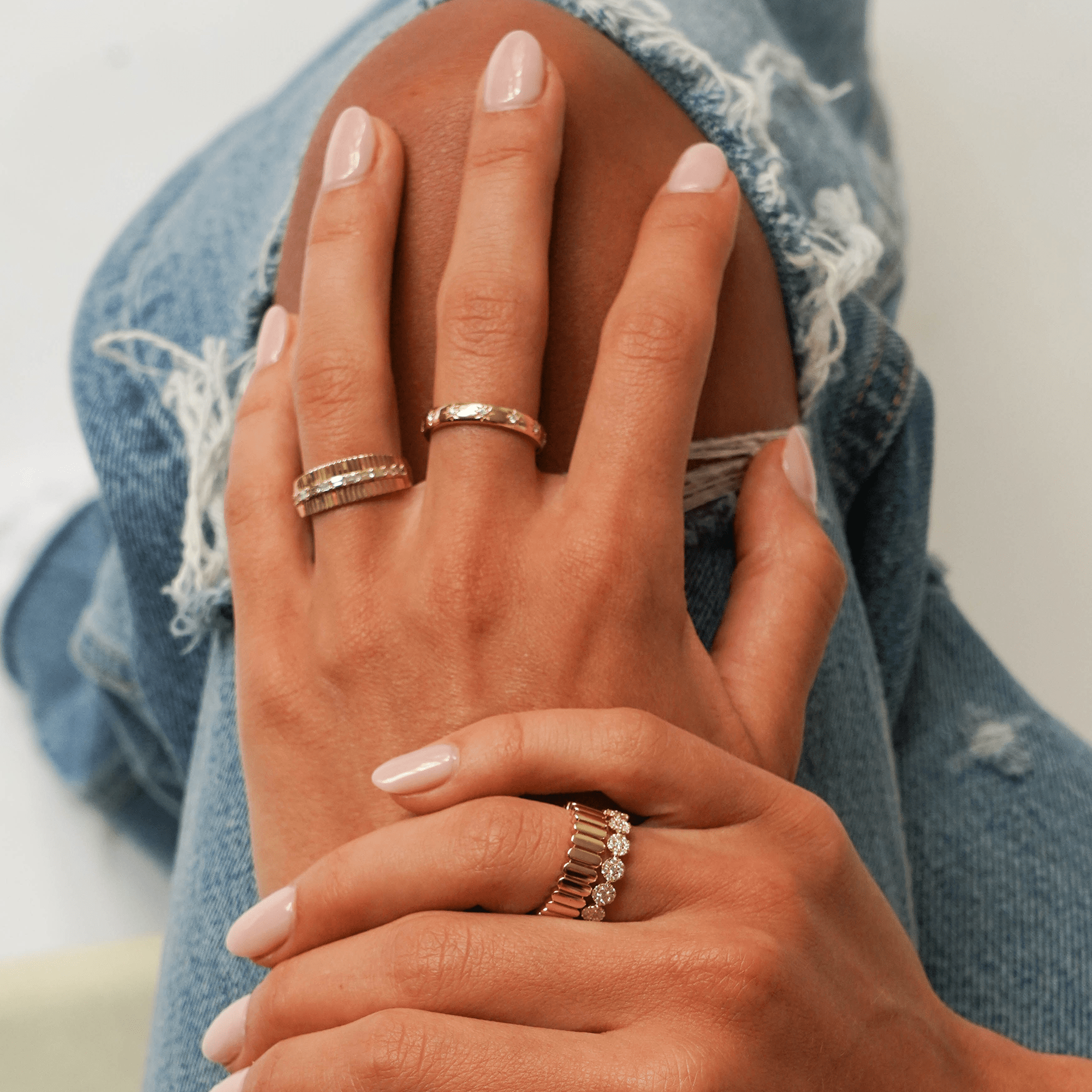 Textured Gold Rings with Ripped Jeans Textured Gold Rings with Ripped Jeans — Stacked Rings