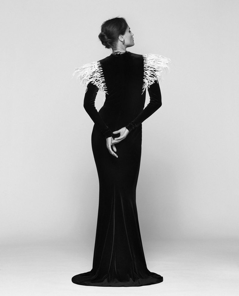 Feather Embellishments: Black Velvet Gown with Dramatic Shoulders Feather Embellishments: Black Velvet Gown with Dramatic Shoulders — Femme Fatale Outfits
