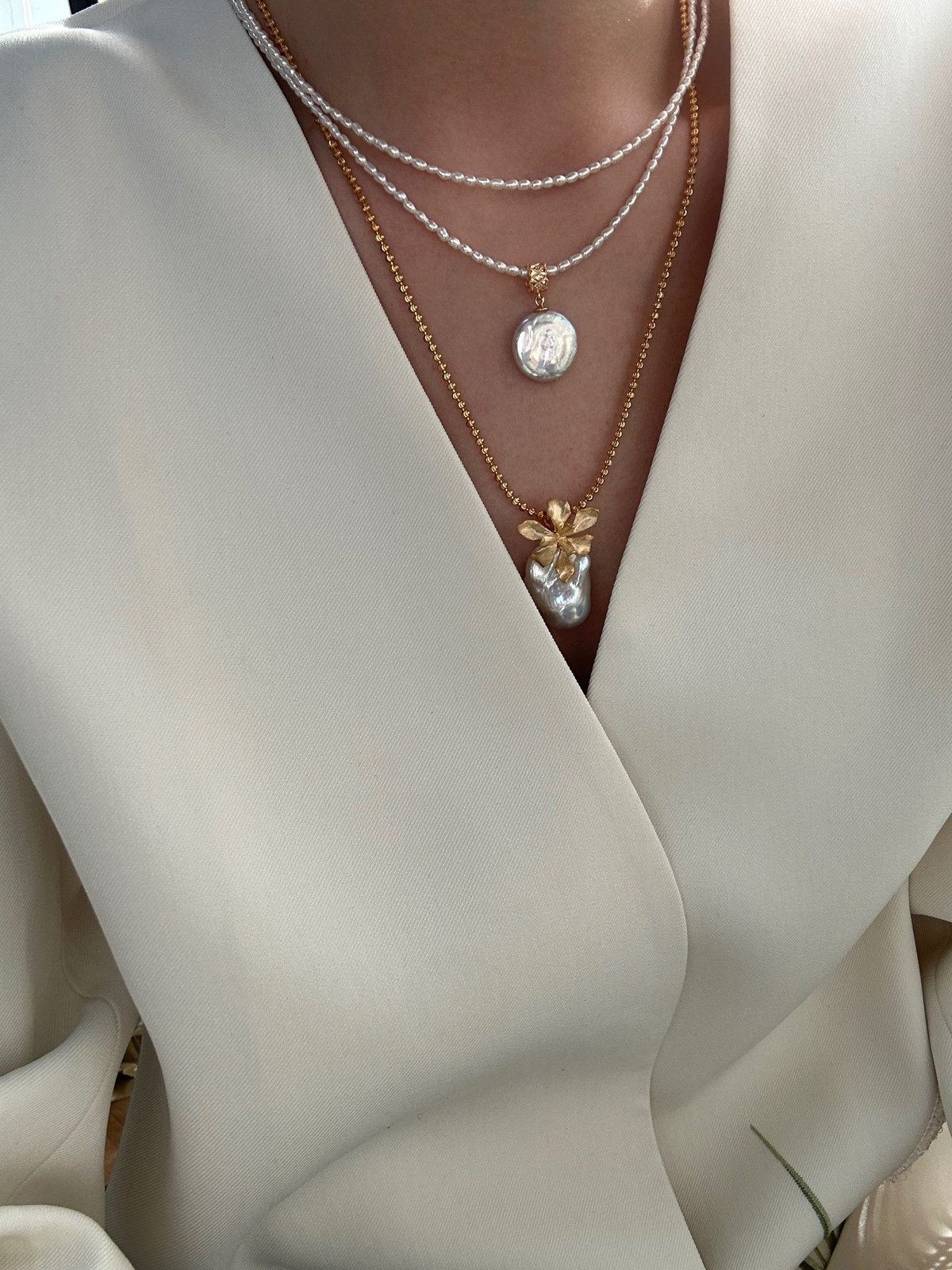 Layered Necklaces with Baroque Pearl Pendant Over Cream Blazer Layered Necklaces with Baroque Pearl Pendant Over Cream Blazer — Pearl Necklace Outfits