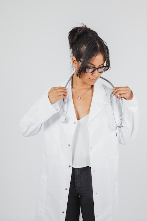 White Lab Coat Over Camisole and Black Trousers White Lab Coat Over Camisole and Black Trousers — Doctor Outfits Women