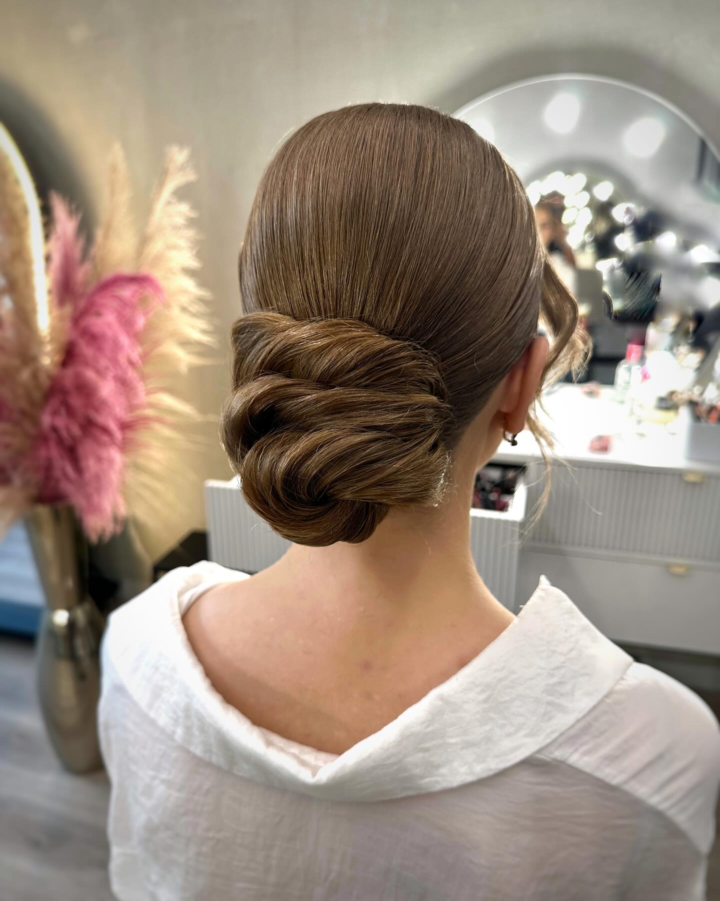 Ash Blonde Textured Braided Low Bun