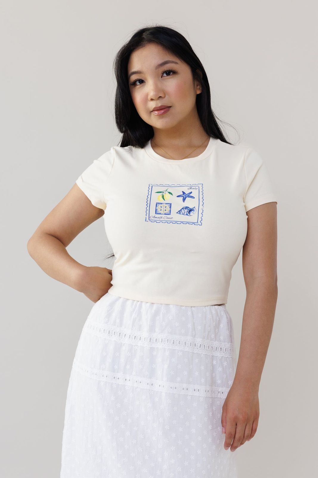 Cream Graphic Baby Tee with Eyelet Skirt and Sneakers Cream Graphic Baby Tee with Eyelet Skirt and Sneakers — Baby Tee Outfits