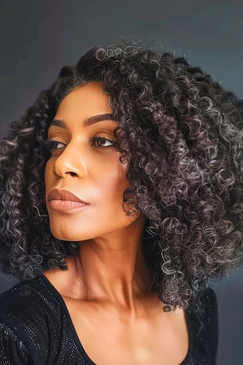 Short Layered Cut With Voluminous Curls — Haircuts for Black Women Over 60
