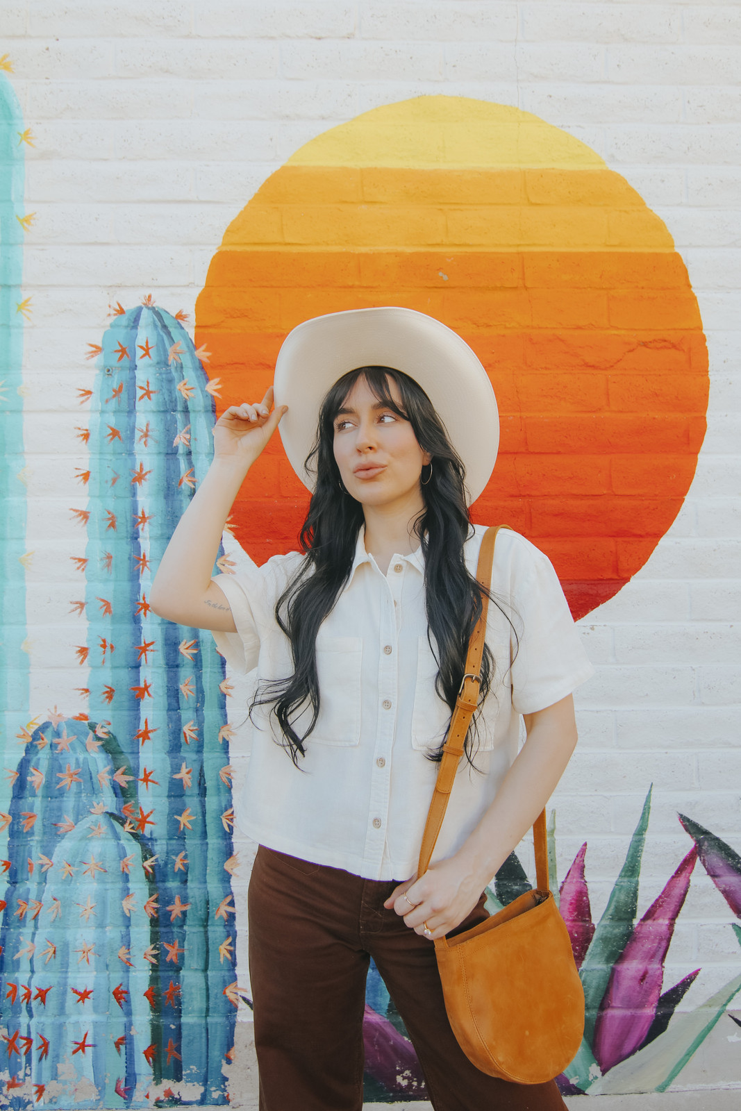 Southwestern Charm: White Shirt, Brown Pants, and Cowboy Hat — Arizona Outfits