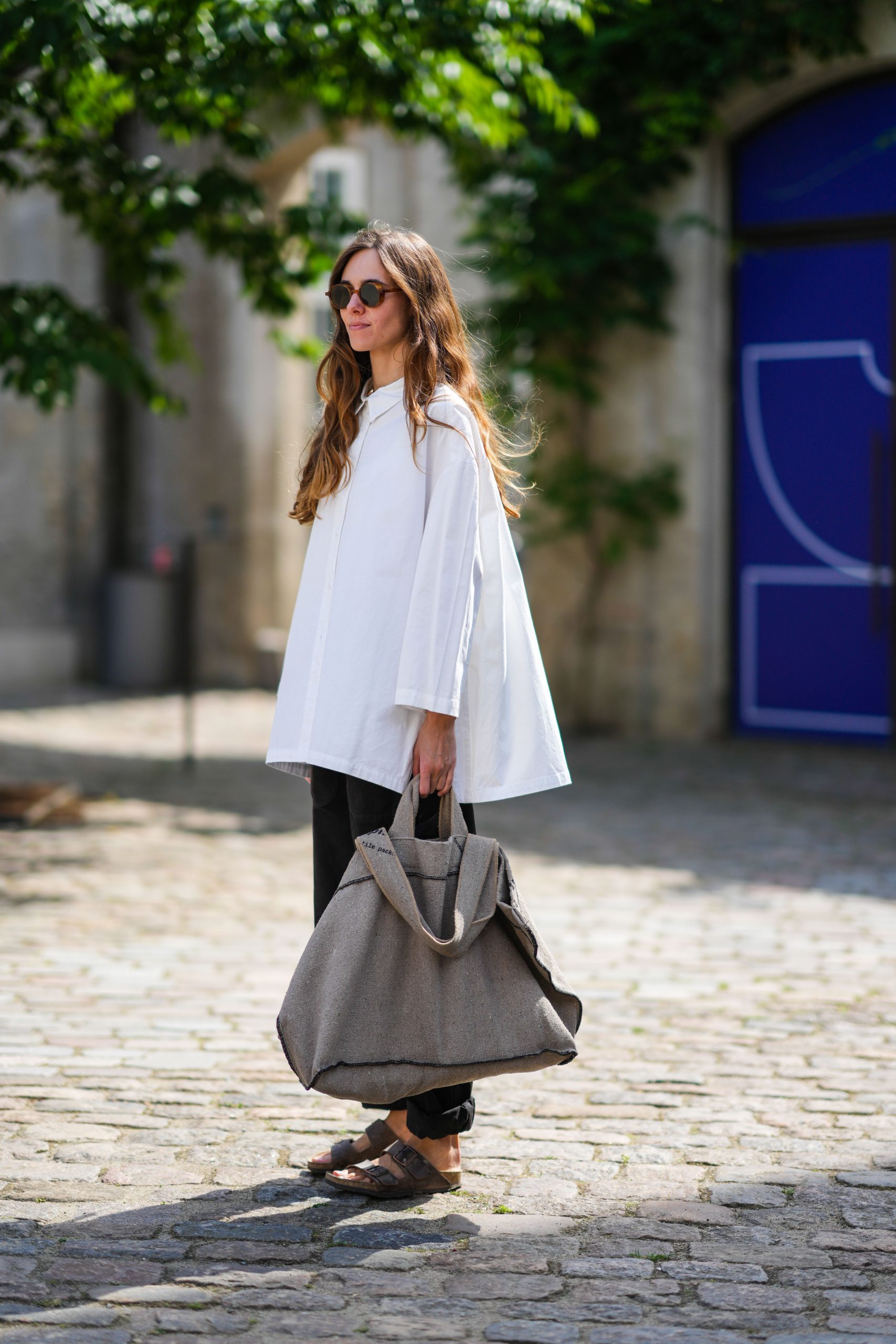 Relaxed Ensemble: Oversized Shirt, Black Trousers, and Brown Birkenstocks Relaxed Ensemble: Oversized Shirt, Black Trousers, and Brown Birkenstocks — Birkenstock Outfits