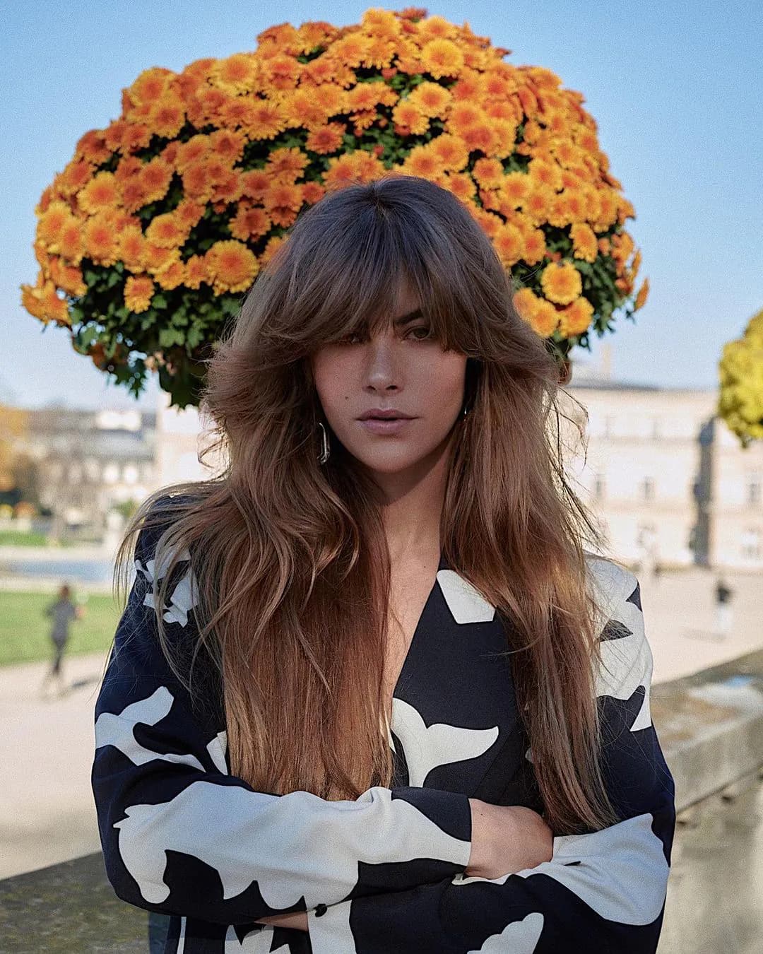 70s Inspired: Voluminous Brown Hair with Bangs and a Patterned Jacket — Long Bangs