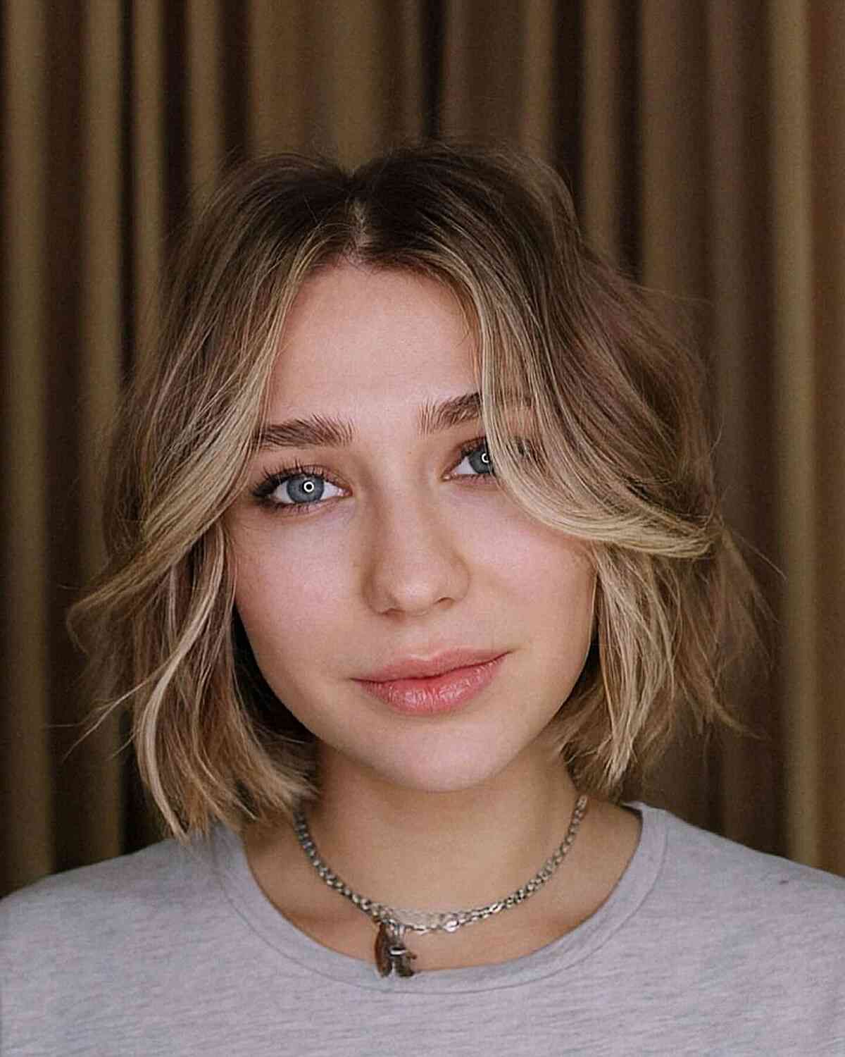 Ash Blonde Bob With Wispy Bangs — Hairstyles for Oval Faces