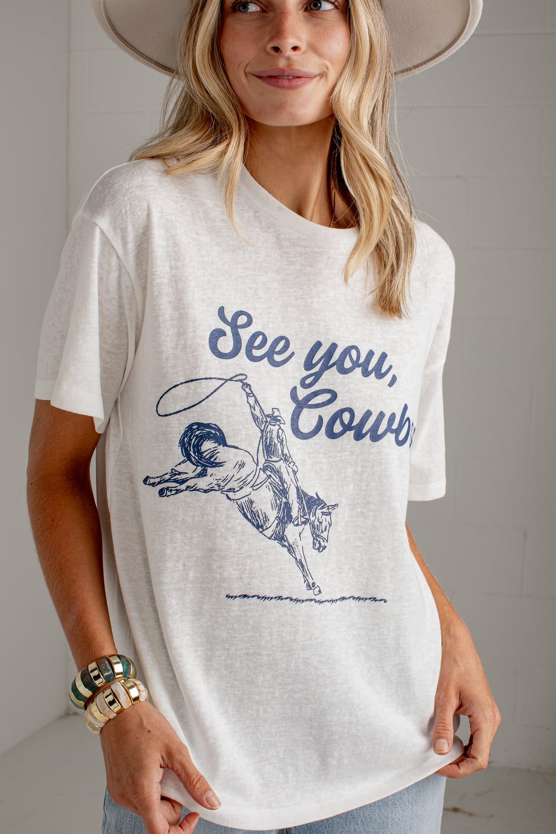 Cowboy Graphic Tee with Denim Shorts and Wide-Brimmed Hat Cowboy Graphic Tee with Denim Shorts and Wide-Brimmed Hat — Graphic Tees