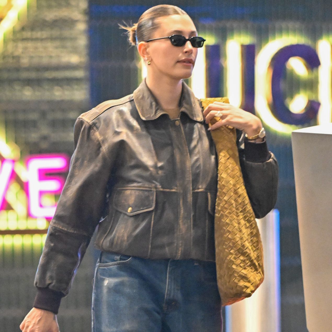 Distressed Leather Jacket and Jeans with a Woven Tote Bag Distressed Leather Jacket and Jeans with a Woven Tote Bag — Bottega Veneta Bag Outfits