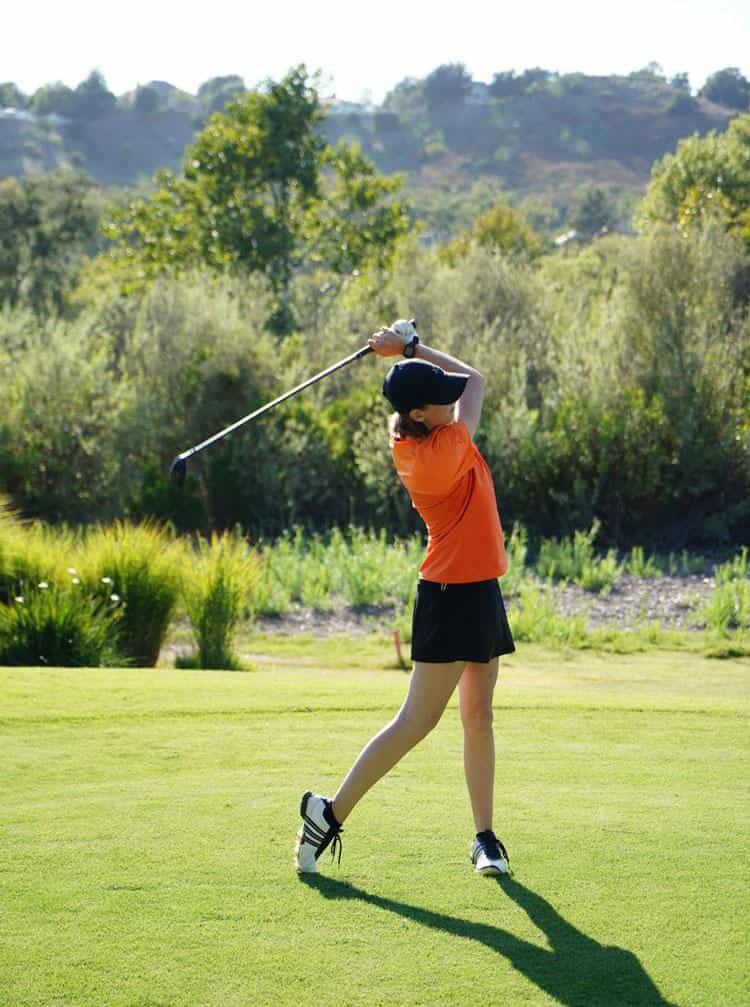 Orange Short-Sleeve Polo and Black Skort for a Bold Golf Statement Orange Short-Sleeve Polo and Black Skort for a Bold Golf Statement — Golf Outfits