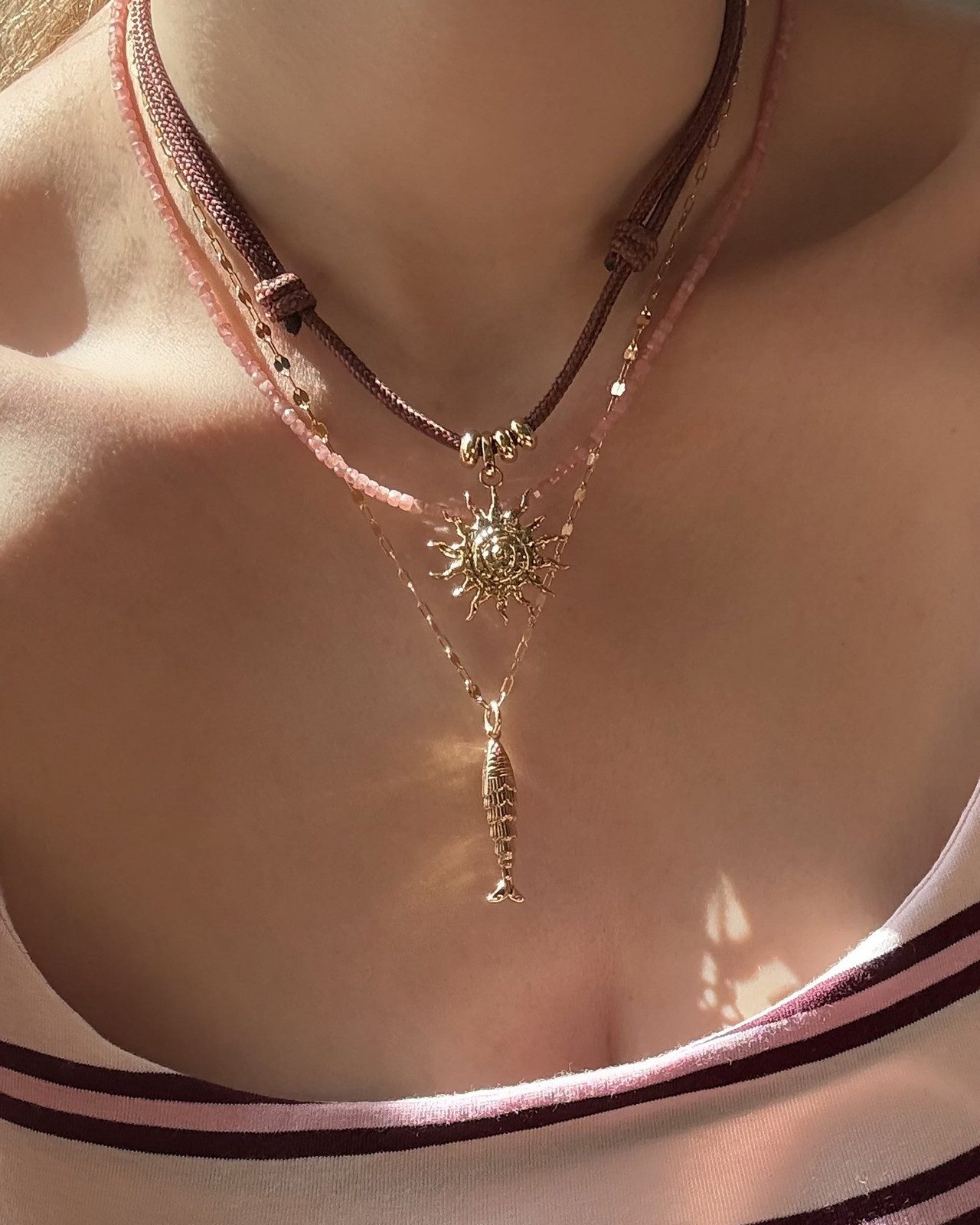Sun and Fish Charms on Layered Chains Sun and Fish Charms on Layered Chains — Charm Necklaces